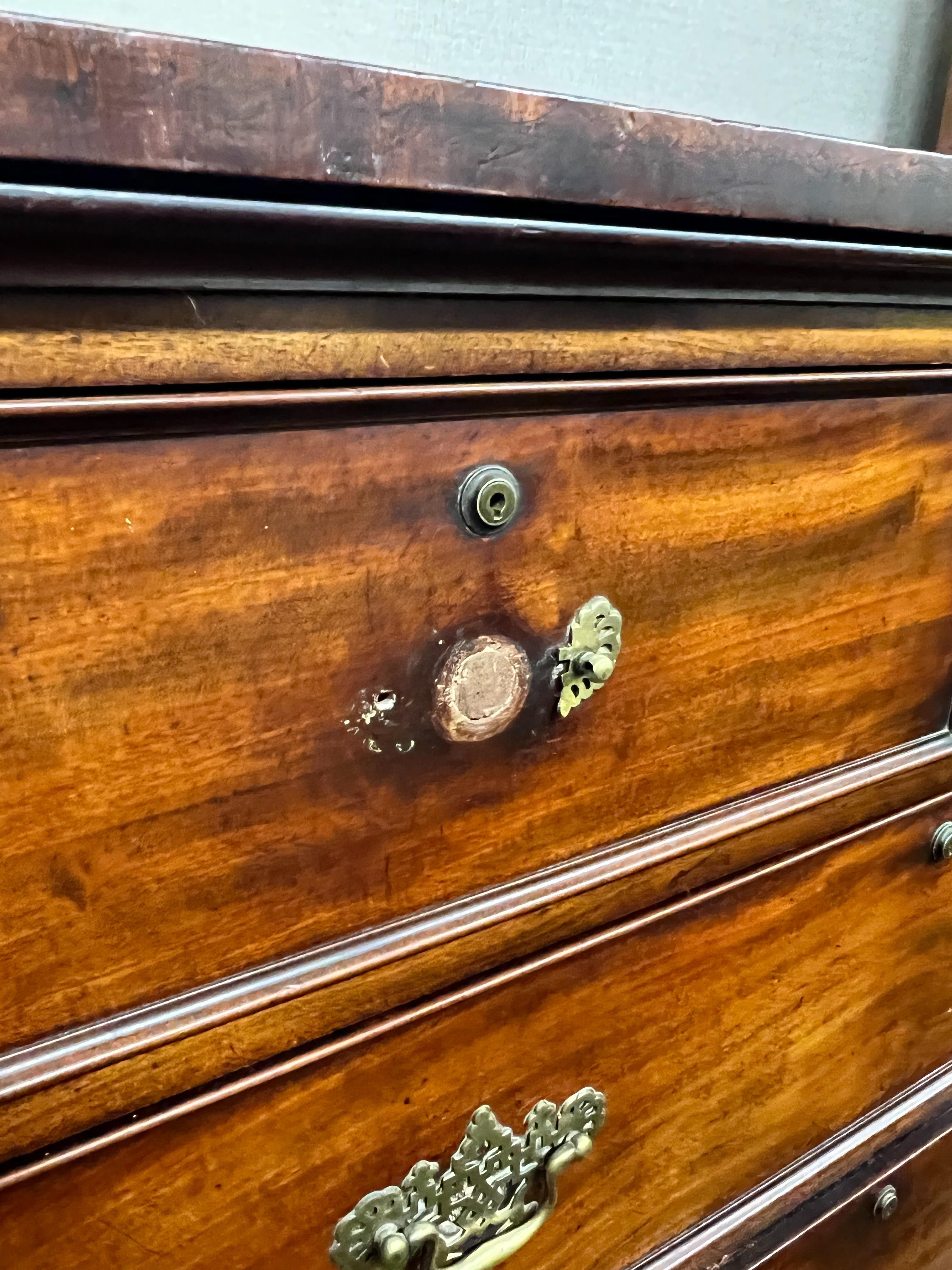 An early Victorian mahogany secretaire chest, fitted two short and four long drawers including a later converted drop front drawer, width 120cm, height 144cm